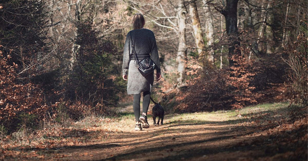 Choices of Self-Reg Blog: Image is of a woman walking her dog in nature