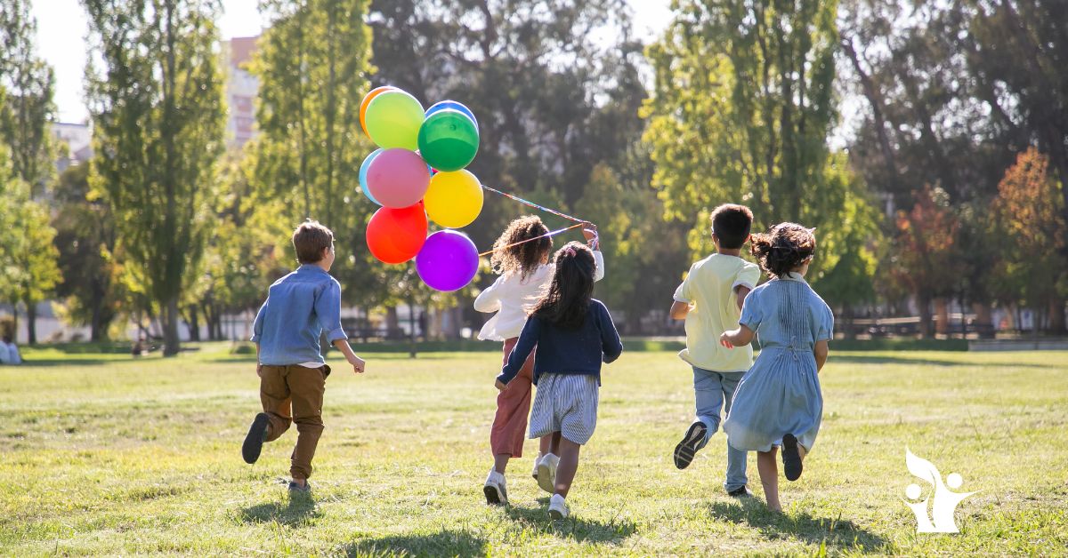 Image is of a group of young children running