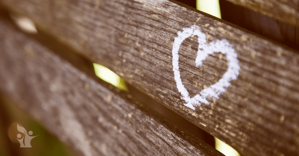 Picture of a white heart drawn on wood slats