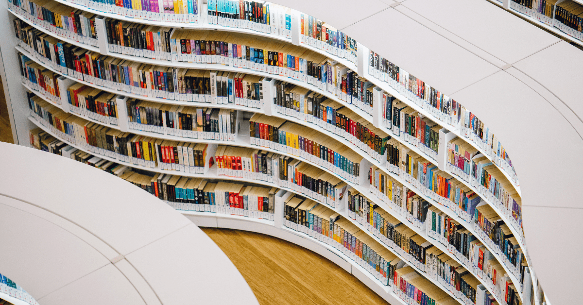 photo looking down on library bookshelves which are in a wavy configuration