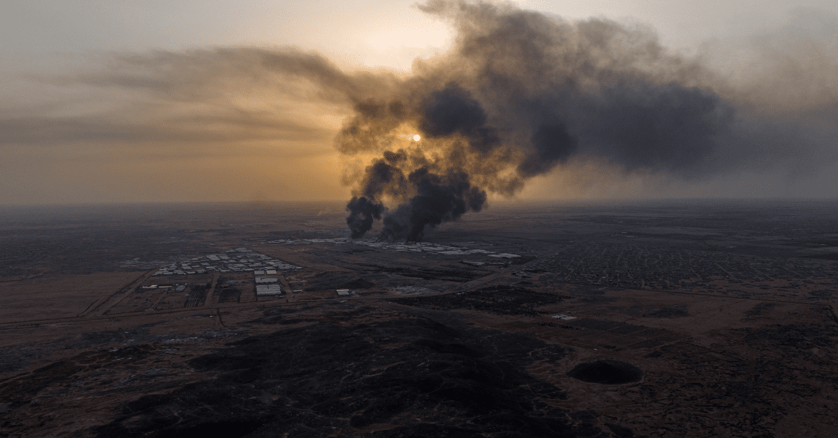 Aerial image of burning fires on the horizon during sunset