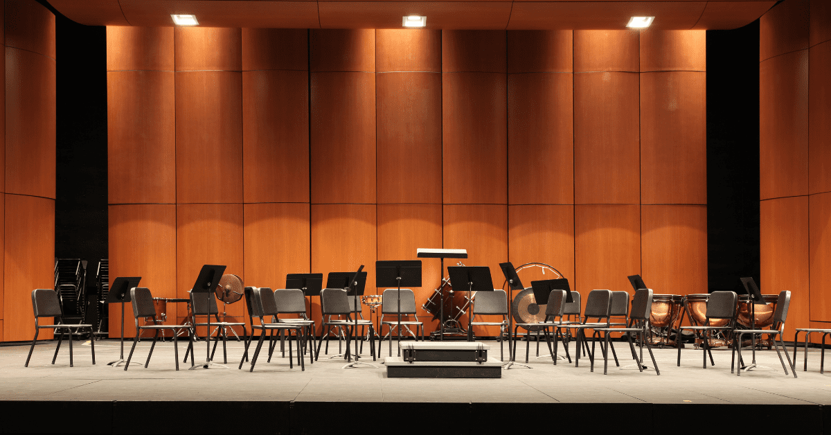 empty orchestra seats on a stage